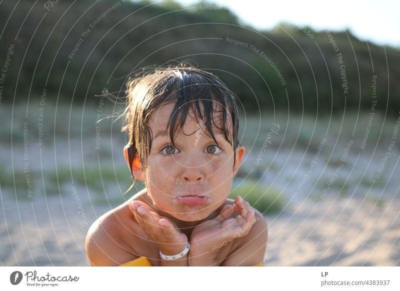 wet child looking puzzled at the camera Looking into the camera Upper body Portrait photograph Copy Space right Copy Space left Cool (slang) Self-confident