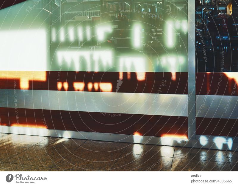Shopping Line Canned Glass Shelves Store premises business Mysterious shadow cast Glittering Sunlight Commerce Offer Shaft of light blurred cordon Glass wall