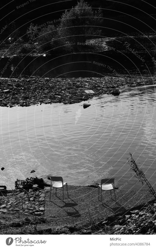 Two chairs on the shore black white Black & white photo shadow and light relax relax lake Sun Sunlight Relaxation Day Reflection Light Shadow Exterior shot