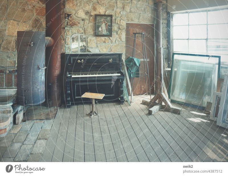 chamber music Room interior room Window Redecorate Piano Sacred image Image of Jesus Rustic Cannon Stove Stovepipe door Wall (building) piano chair makeshift