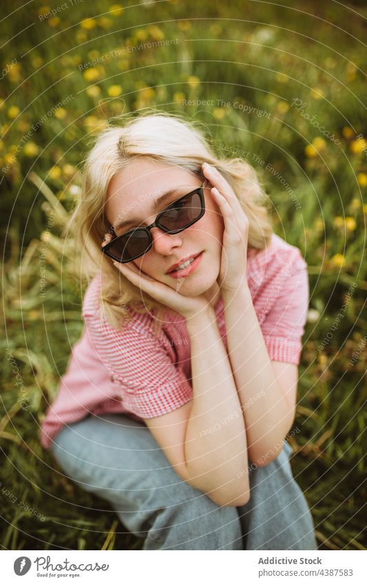 Tranquil stylish woman in summer field style trendy sunglasses tranquil serene meadow fashion female charming dreamy calm nature flower peaceful lawn enjoy