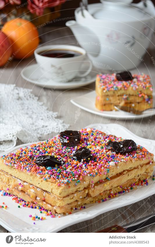 Tasty cake with nougat and prune on plate turron de dona pepa dessert dragee delicious sweet treat serve tasty food tradition cuisine gourmet yummy pastry