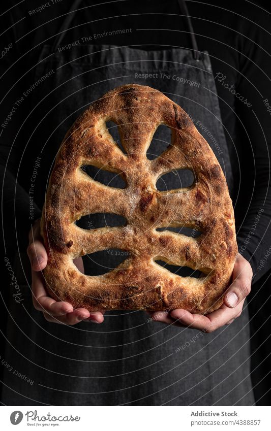 Male cook with fresh fougasse bread baked delicious man tradition bakery homemade male chef loaf tasty food cuisine natural yummy recipe meal culinary guy