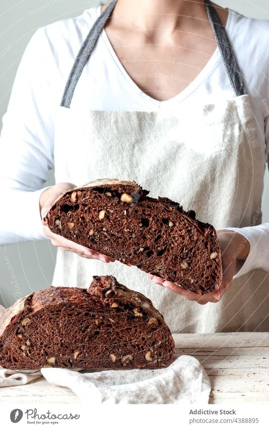 Hands holding freshly baked sourdough bread hand food rye healthy organic half grain woman baker delicious traditional soft flour tasty breakfast cereal natural