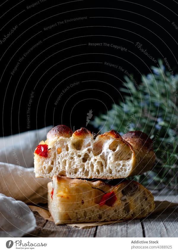 Close up of one piece of fresh tomato focaccia with rosemary baked food homemade traditional italian portion bread gourmet vegetable vegetarian dough meal lunch