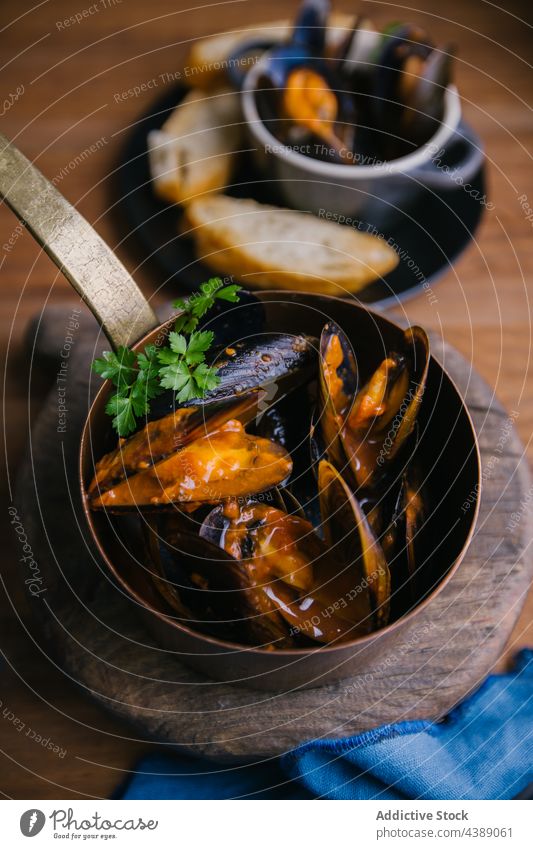 Steamed Mussels mussels saucepan herbs cooking kitchen mollusk seafood lunch gourmet dish shellfish meal restaurant clam cuisine delicious tasty yummy water