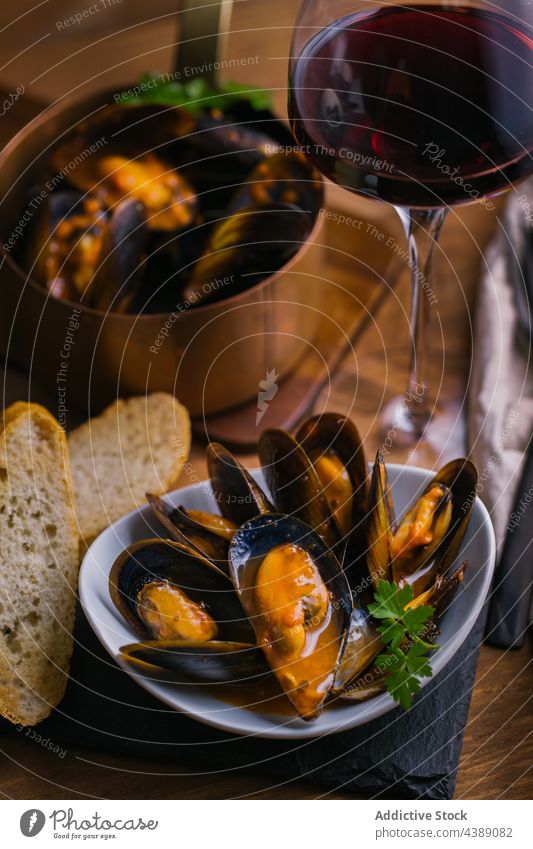 Steamed Mussels mussels bowl herbs cooking kitchen mollusk plate seafood lunch gourmet dish shellfish meal restaurant clam cuisine delicious tasty yummy