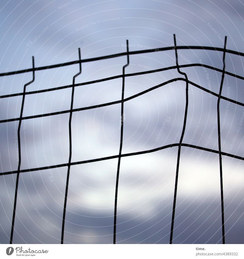 Interspaces | Stories from the Fence (107) Sky warped Metal Metalware Evening evening light evening sky Hoarding lines Protection Backup Collateralization peak