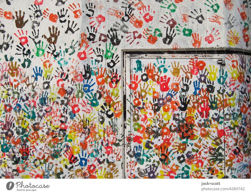 Hand for hand on wall Street art Imprint Many Teamwork Play of colours Creativity Agreed Abstract Silhouette Decoration Background picture