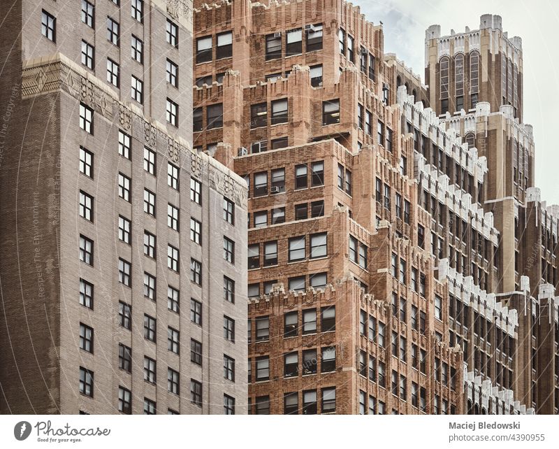 New York old architecture, color toning applied, USA. city building Manhattan photo wall brick NYC window facade retro toned effect