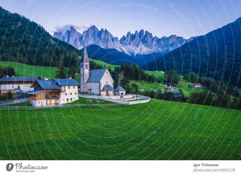St Magdalena church in Val di Funes valley, Dolomites, Italy. Furchetta and Sass Rigais mountain peaks in background italy dolomites funes landscape nature