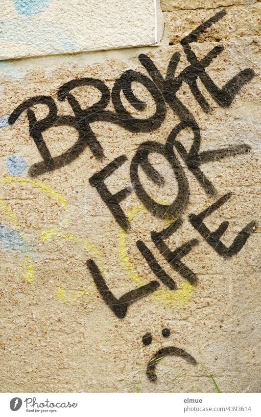 BROKE FOR LIFE is written in black capital letters on the beige spray-painted wall / broke for life Wall (building) Graffito Graffiti Colour Word Plastered