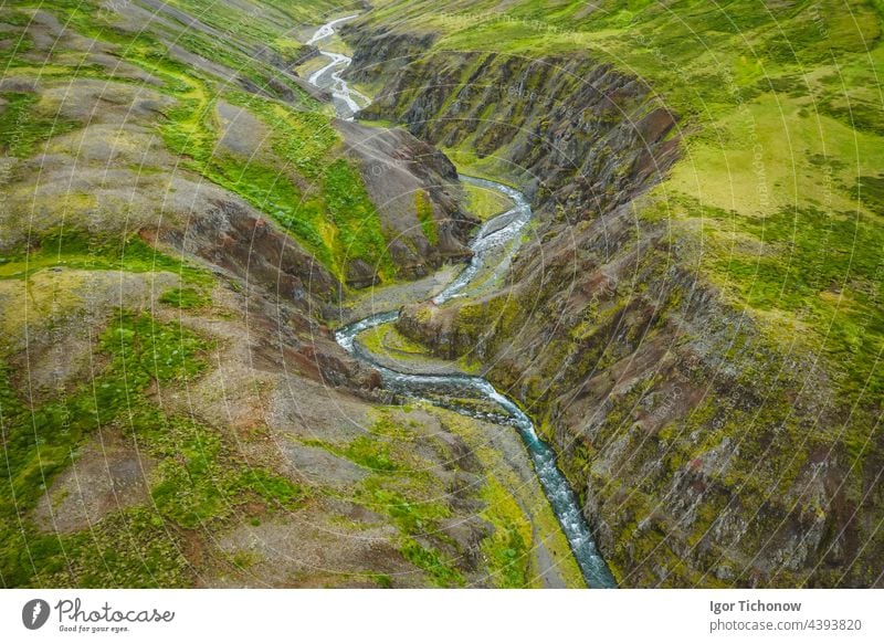 Drone view over green hills, canyon and small river in Iceland, summertime iceland waterfall footage drone landscape nature aerial travel tourism icelandic