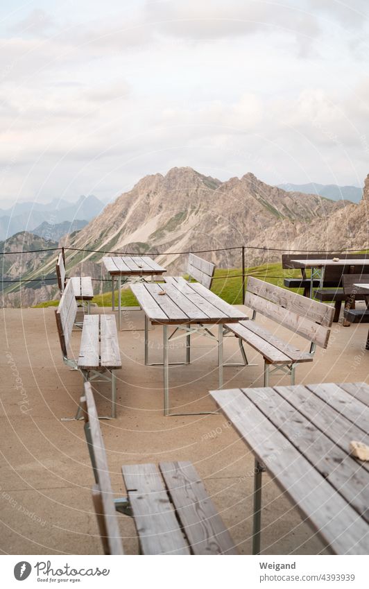Empty volumes on a mountain hut in the Alps Allgäu Alpine hut Pass corona benches Break void silent Peak Hut