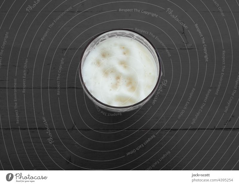 a beer is on the table Beer Beer garden Gastronomy Beer glass Monochrome Froth Beer table plan Neutral Background Structures and shapes Beverage