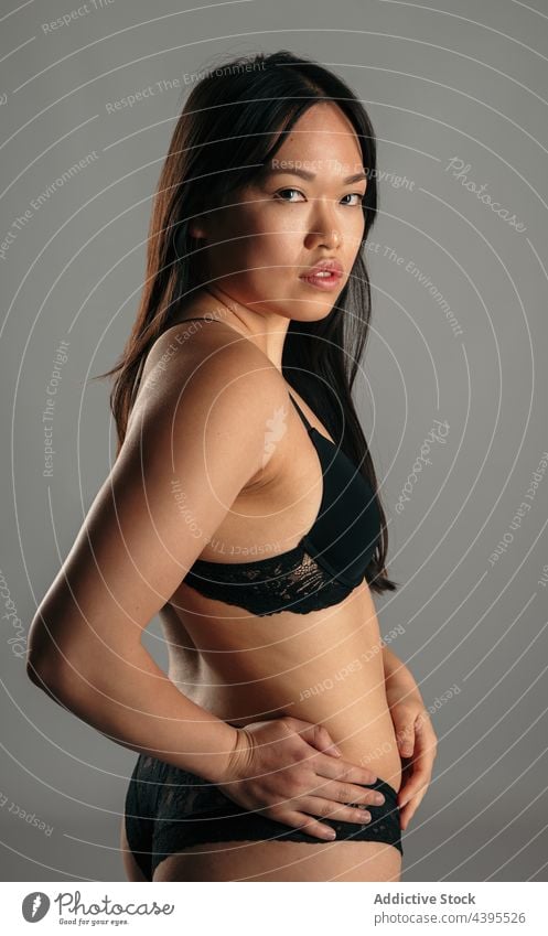 Asian woman in underwear in studio body positive lingerie confident accept appearance figure female asian ethnic bra panties complexion calm serene determine