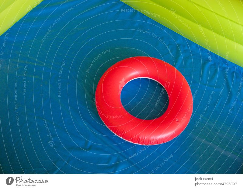 red bathing ring in empty inflated pool swim ring Ring Empty Dry Red Blue Bathroom ring Inflatable colour contrast Lifestyle Paddling pool Kiddy pool Plastic