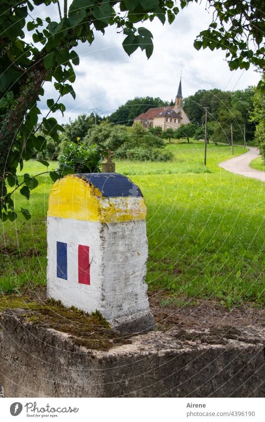 Order in chaos | each to his own liking Border landmark Church Village Stone flag national France French Tricolor Rural Idyll rural Borderland Border area