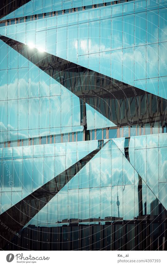 Modern architecture - glass facade of the 3XN Cube in Berlin at the main station with reflection of the TV tower Colour photo Exterior shot Deserted Detail