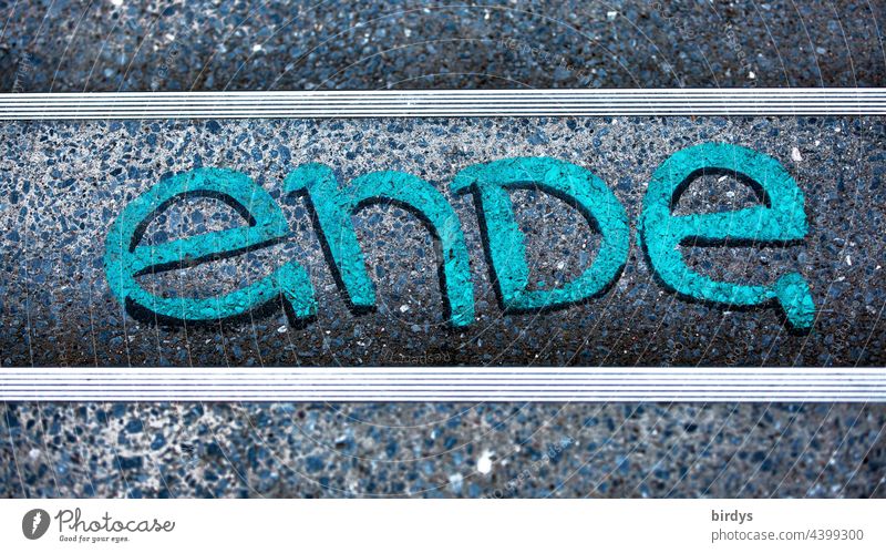 End, writing, turquoise graffiti on a staircase from a bird's eye view ending Quit finished finally Typography Characters Word lines symmetry stair treads
