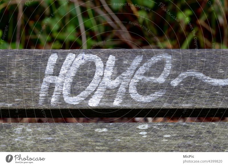 home Bench Park bench board Wood Inscription Graffiti lettering at home Exterior shot Deserted Seating Relaxation Loneliness Calm Wooden bench Empty Daub Art
