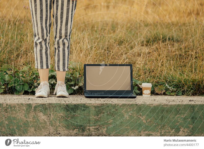 freelancer concept with laptop and coffee cup outdoors 5g business computer design developer digital display green hiring internet job keyboard monitor nature