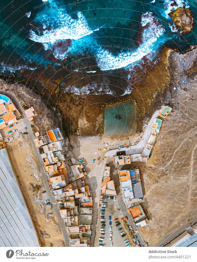 Arial view of coastal city near sea landscape building rooftop settlement beach seashore seaside scenic scenery town district house picturesque water village