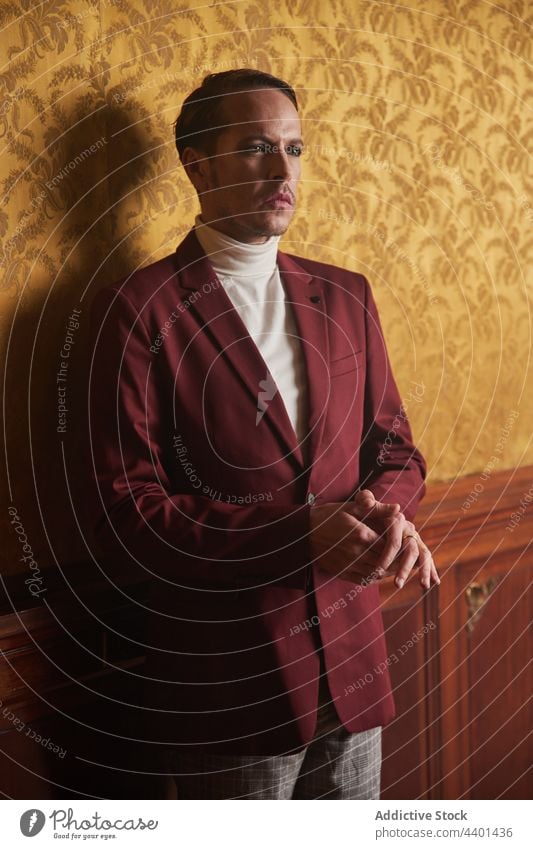 Pensive man in classy outfit pensive thoughtful confident actor perform style dreamy vintage ponder gentleman male adult art artist elegant serious well dressed