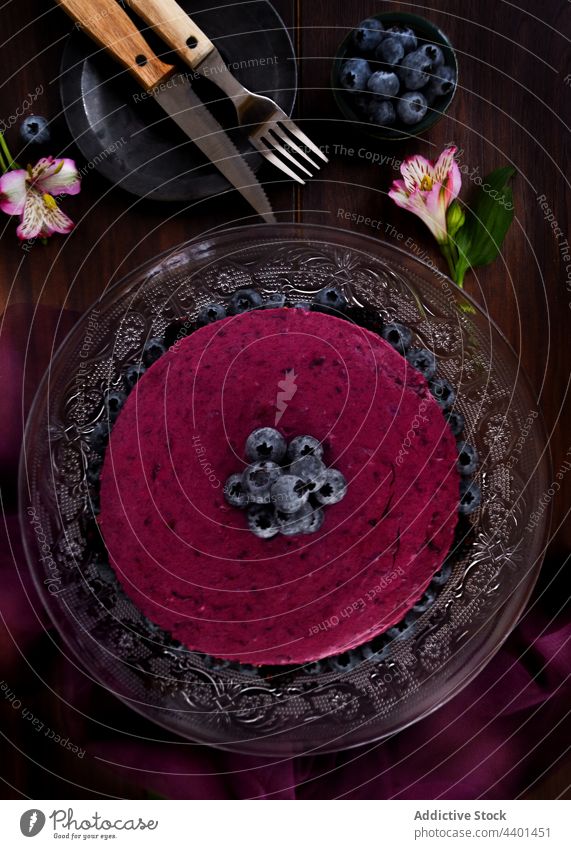 Sweet blueberry cake in table cream mousse dessert stand serve dark sweet decor delicious food tasty yummy treat baked fresh biscuit ripe pastry decoration