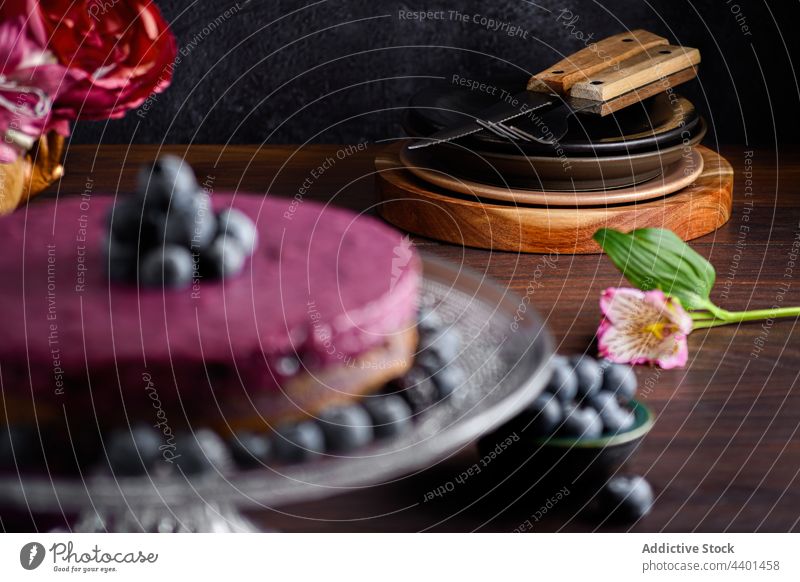 Sweet blueberry cake in table cream mousse dessert stand serve dark sweet decor delicious food tasty yummy treat baked fresh biscuit ripe pastry decoration