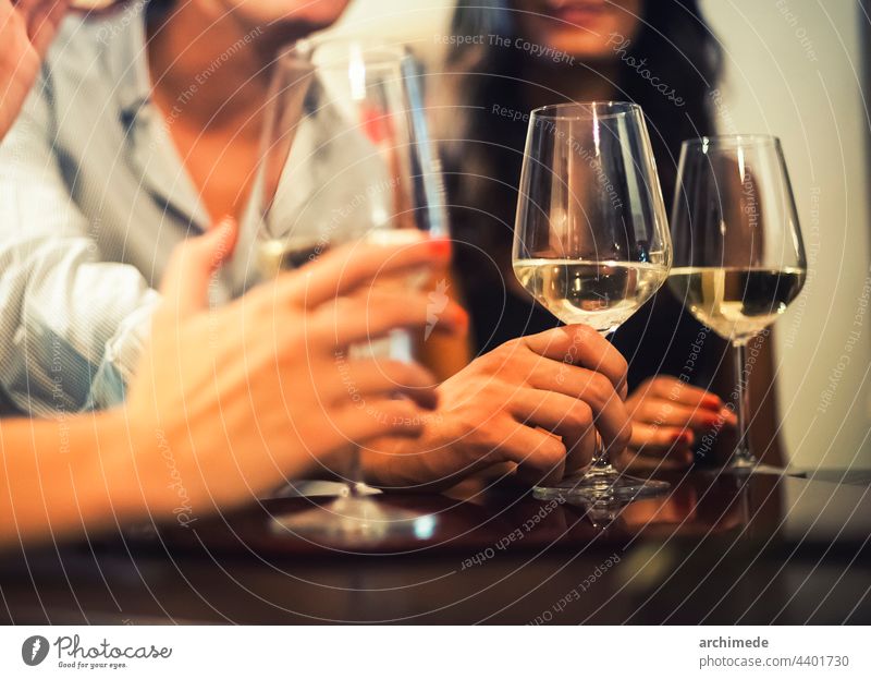 friends drinking together fun party toasting hangout hang out friendship wine glass alcohol nightlife club bar restaurant hand close up in hand lifestyle people