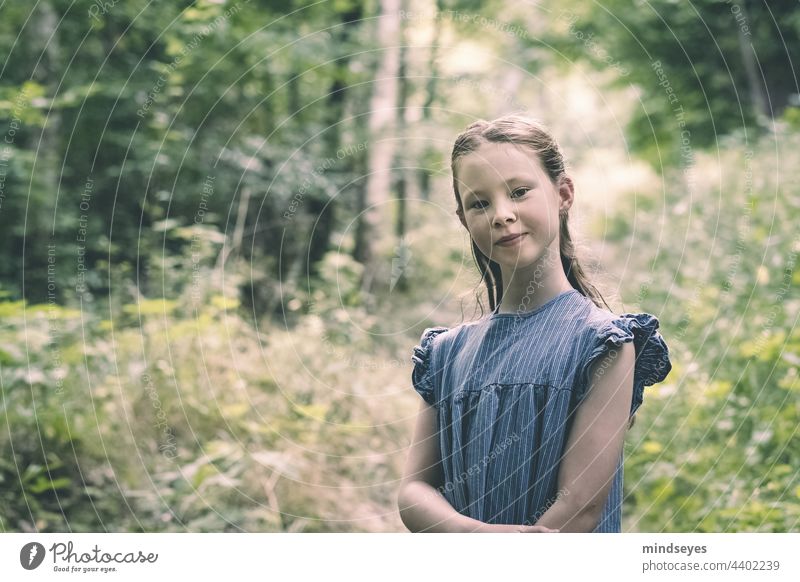 Girl in the forest smiles into the camera Nature Forest Child Infancy Summer Playing Happiness Portrait photograph selbstbewußt Smiling childhood children