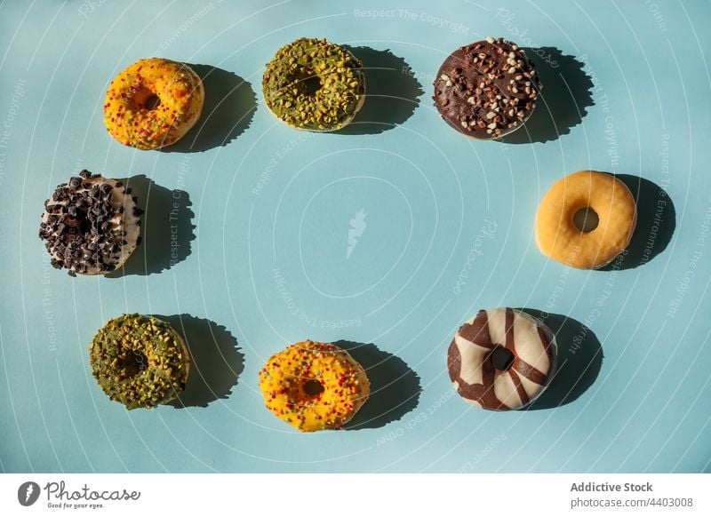 Top view of some delicious donuts doughnut flat iced top fat background diet lay space assorted food collection many dessert cake copy snack concept set