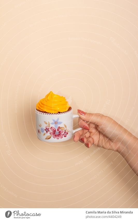Hand Holding Mug Cake, Cupcakes, Copy Space For Your Text. Studio photo. anniversary birthday breakfast closeup cup cupcake delicious food hand holding isolated