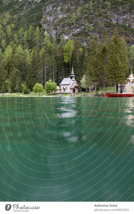 Church located on shore of lake church pond mountain scenery water blue landscape building religion lake braies pragser wildsee dolomite italy alps highland