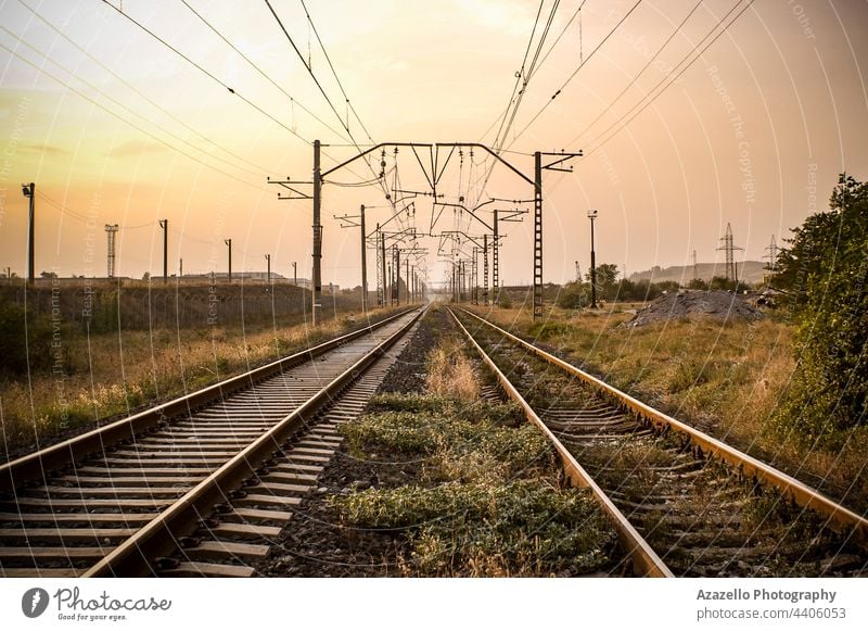 View of a railway during sunset. background blue concept day direction electrical hdr horizon industrial industry infinity iron journey landscape line metal