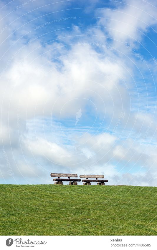 Standing two benches on the green dike under blue sky with clouds Bench Dike Sky Lawn Green Blue Relaxation Meadow Summer Grass Beautiful weather