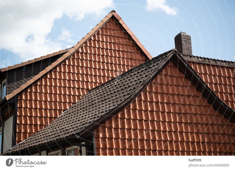 plain exterior facade of old half-timbered house covered with red roof tiles Roofing tile Red Old Historic Half-timbered house Dress up Disguised Concealed