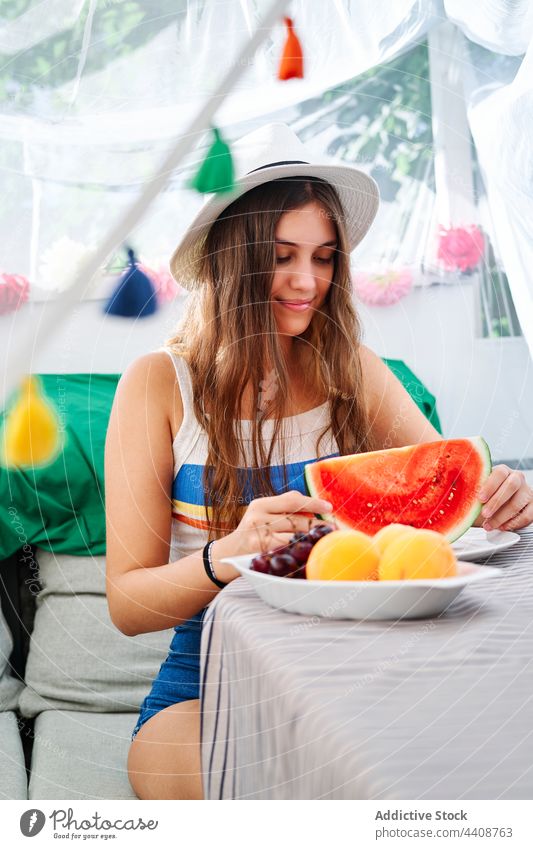 Cheerful woman with fresh watermelon sweet summer ripe young tasty backyard tent female smile cheerful happy eat enjoy delicious positive healthy organic