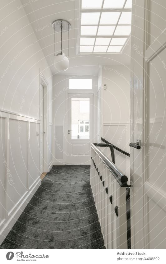 Hallway interior with white walls hallway home design staircase corridor building architecture attic railing apartment modern window narrow residential house