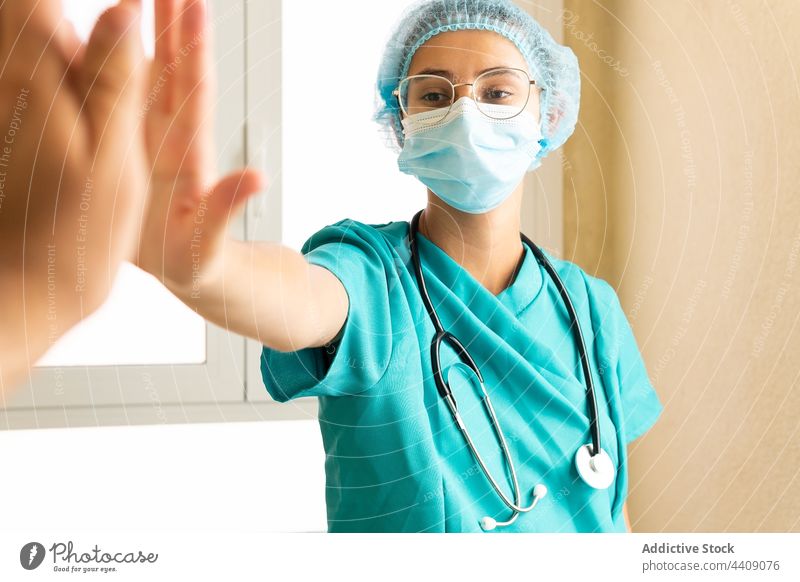 Doctors giving high five to each other in clinic doctor colleague together work medic gesture hospital coworker professional medical health care uniform staff