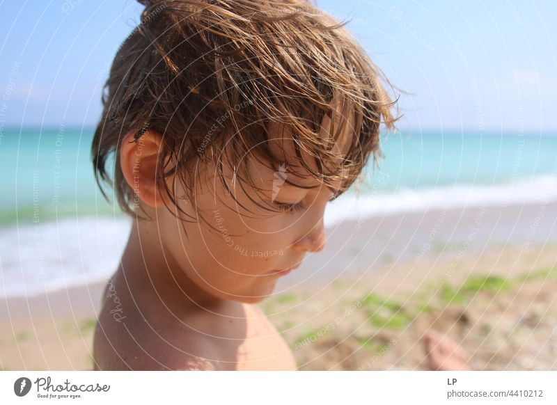 half face of a beautiful child looking  down Individual Isolated Single Abstract Flow Children's game Childhood memory candid dreamy singular Exceptional