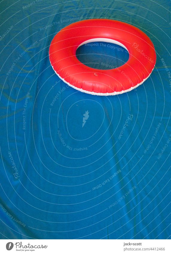 occupied | with red bathing ring in empty inflated pool swim ring Ring Empty Dry Inflatable Bathroom ring Blue Red colour contrast Lifestyle Plastic Kiddy pool