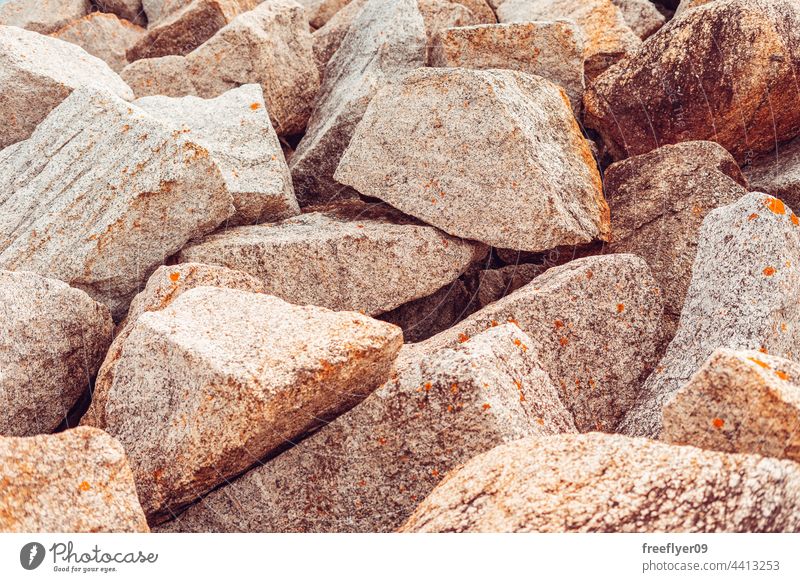 big granite stones piled up rocks texture copy space mining mine collection wallpaper chunks artificial breakwater seawall shore horizon mountain blue coastline