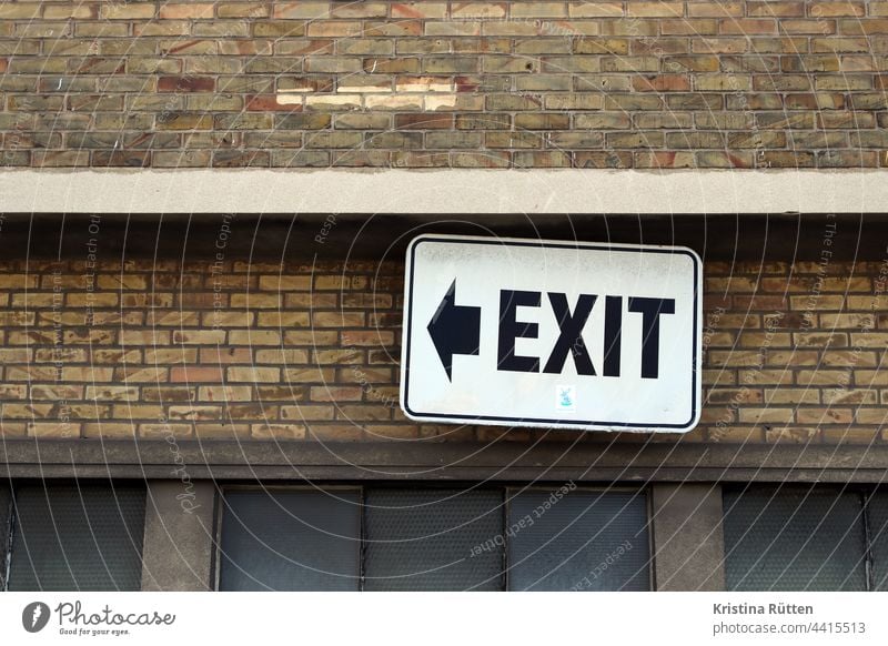 exit Way out sign Clue Direction Arrow Road marking off signpost groundbreaking that way route Orientation Sign symbol Building Facade Exit route