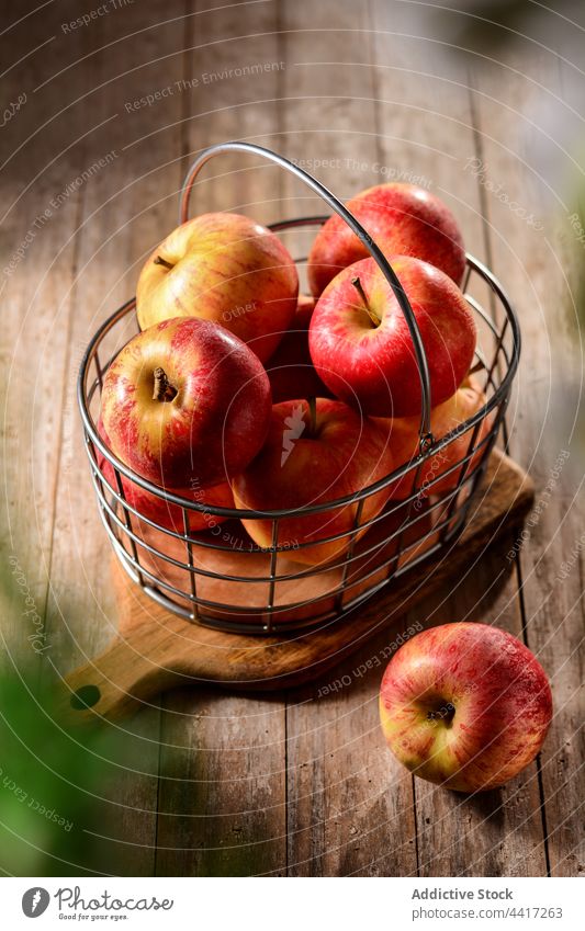 Delicious fresh apples in basket on cutting board fruit vitamin sweet natural ripe harvest countryside delicious tasty organic summer red color yummy scent