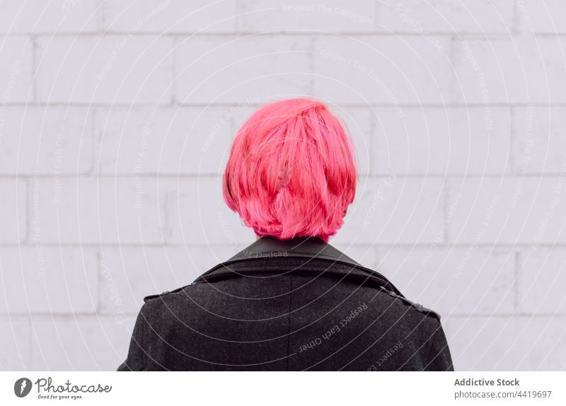 Crop woman with pink hair trendy style hairstyle creative urban contemporary unusual neck female wall individuality personality fashion cool modern provocative