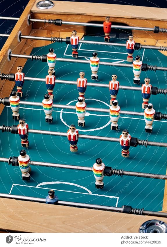 Part of vintage table football soccer foosball retro wooden figurine miniature player old fashioned nostalgia classic design style detail part fragment metal