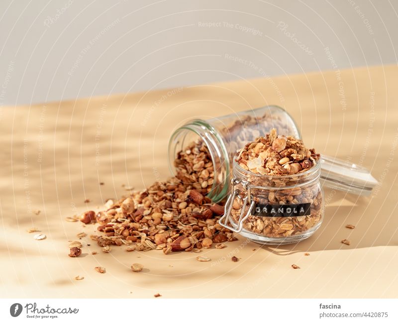 Granola on beige. Copy space. Top view granola aesthetic breakfast muesli jar pastel oatmeal copy space flatlay authentic homemade champagne sprinkled glass