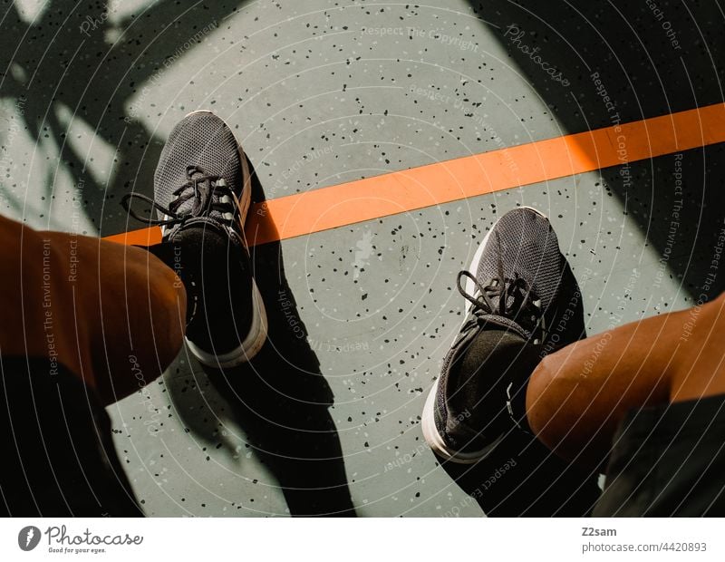 Man on train Athletic Cool Trip Train Track Wait holidays vacation voyage free time Transport Sun Shadow Light lines Pattern graphically warm Legs sneakers